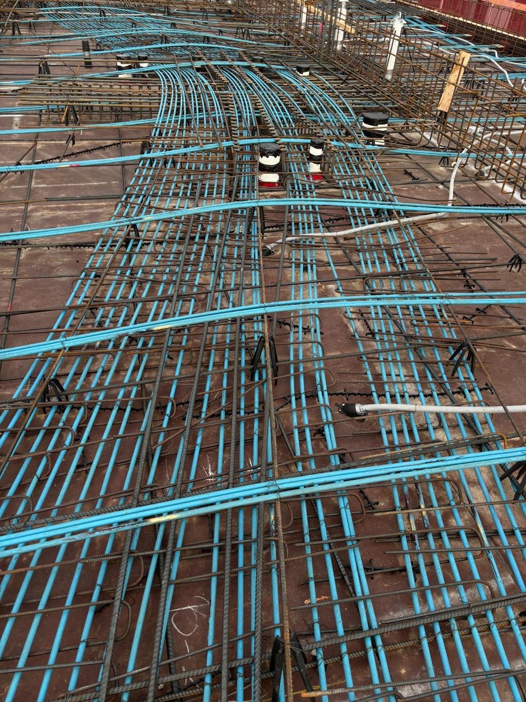 Tendons sweeping around column locations on a deck