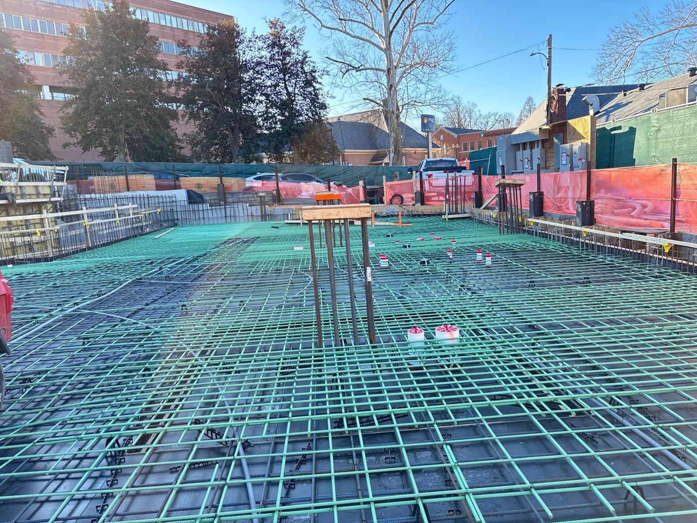 Green epoxy-coated rebar mat on a slab